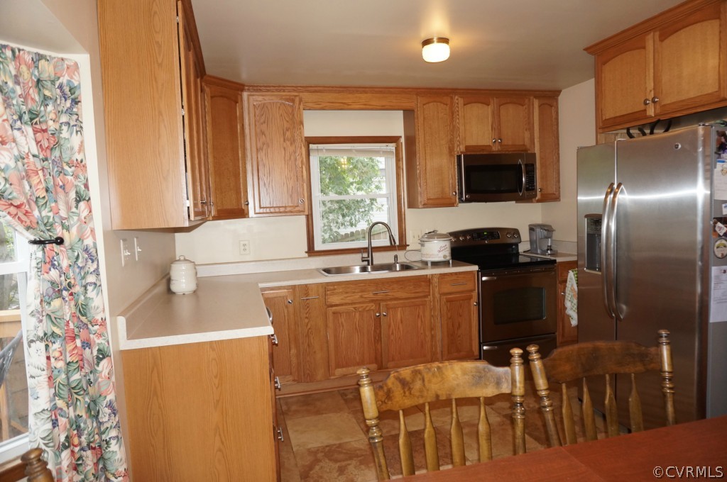 7012 Full Rack Drive Midlothian, VA 23112 - Photo 12 of 24 a kitchen with a sink cabinets and appliances