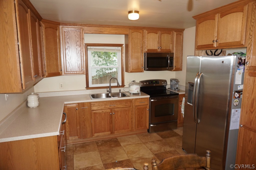 7012 Full Rack Drive Midlothian, VA 23112 - Photo 13 of 24 a kitchen with stainless steel appliances a refrigerator sink and microwave
