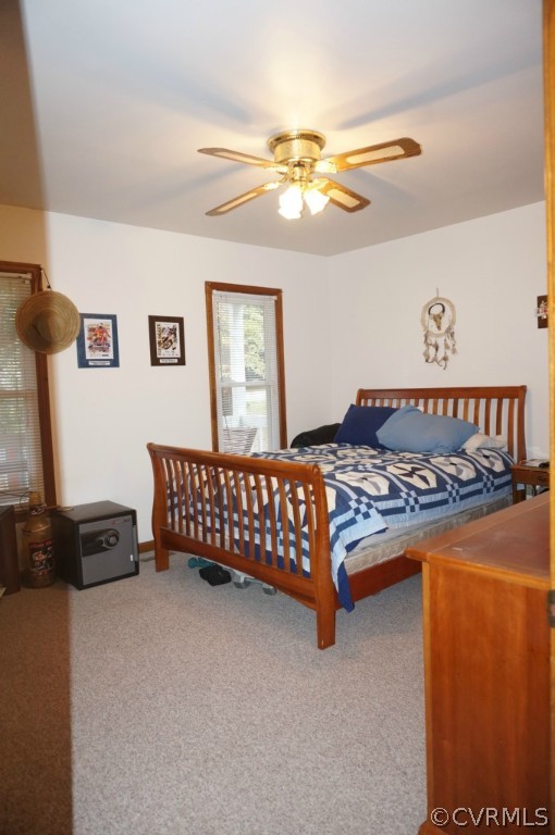7012 Full Rack Drive Midlothian, VA 23112 - Photo 14 of 24 a bedroom with a bed and a chandelier