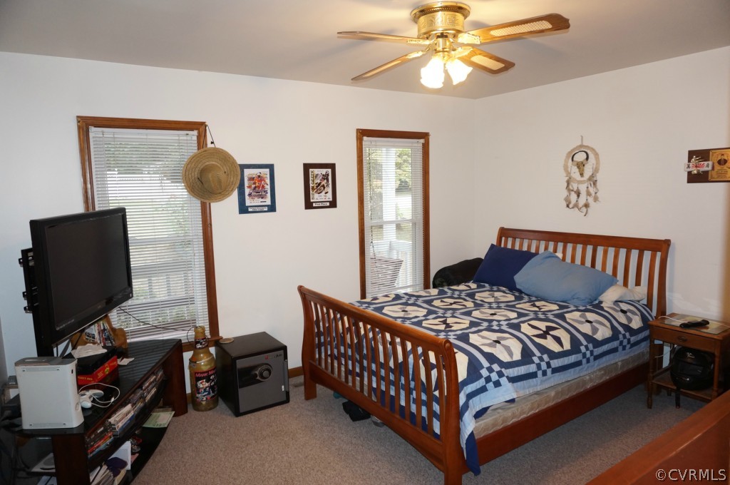 7012 Full Rack Drive Midlothian, VA 23112 - Photo 15 of 24 a bedroom with a bed and a flat screen tv