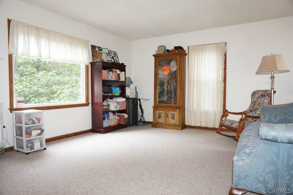 7012 Full Rack Drive Midlothian, VA 23112 - Photo 20 of 24 a view of a livingroom with furniture and a large window