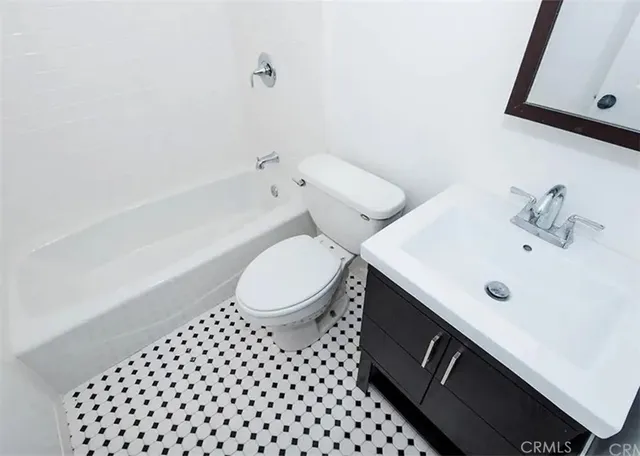 a kitchen with stainless steel appliances granite countertop a stove microwave and sink