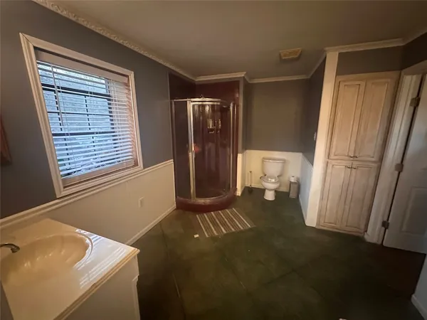 a living room with a couch wooden floor and a window