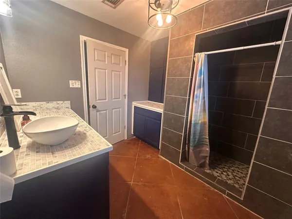 a big room with closet and windows