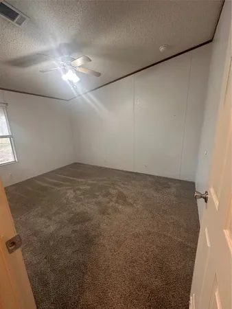a view of living room with granite countertop furniture a sink and dishwasher