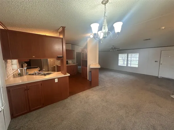 a view of an empty room with a fireplace