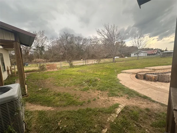 a view of swimming pool with outdoor seating and plants