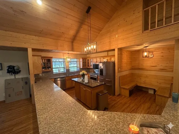 a living room with furniture and wooden floors