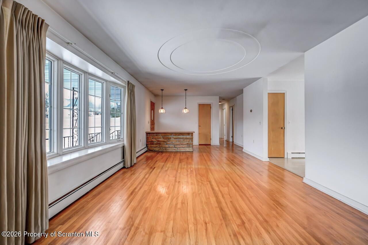 148 Green Grove Road Scott Township, PA 18447 - Photo 15 of 67 a view of an empty room with wooden floor and a window
