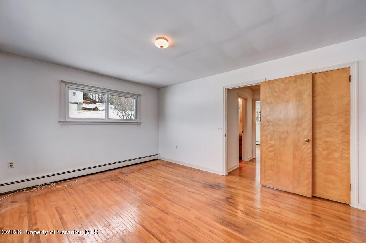 148 Green Grove Road Scott Township, PA 18447 - Photo 30 of 67 a view of an empty room with wooden floor and a window
