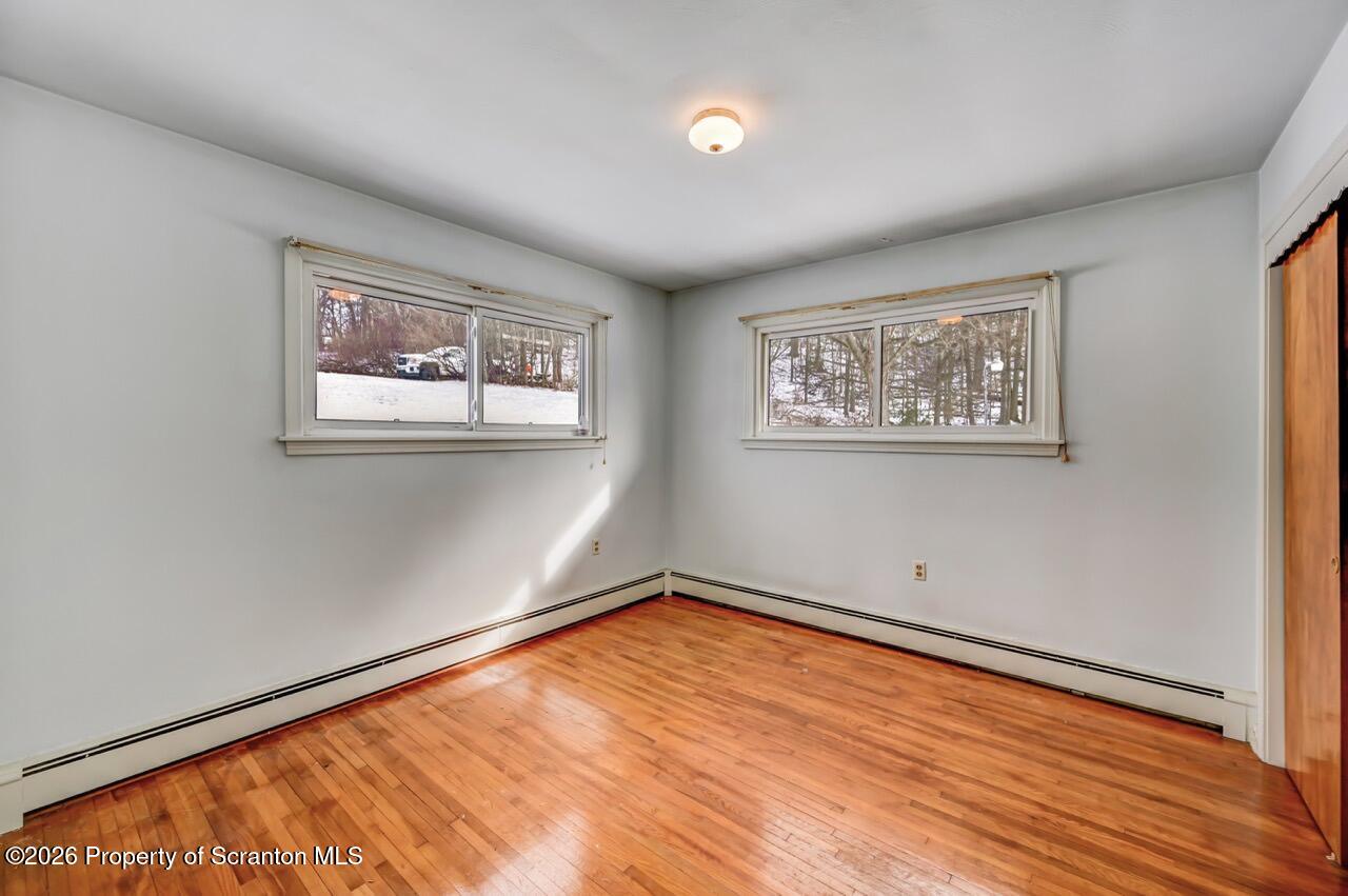 148 Green Grove Road Scott Township, PA 18447 - Photo 35 of 67 a view of room with window and wooden floor
