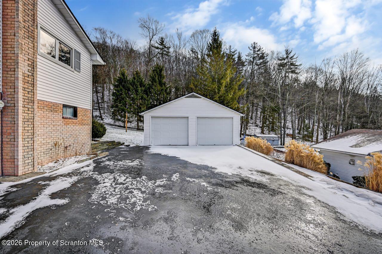 148 Green Grove Road Scott Township, PA 18447 - Photo 4 of 67 a front view of a house with a yard and garage