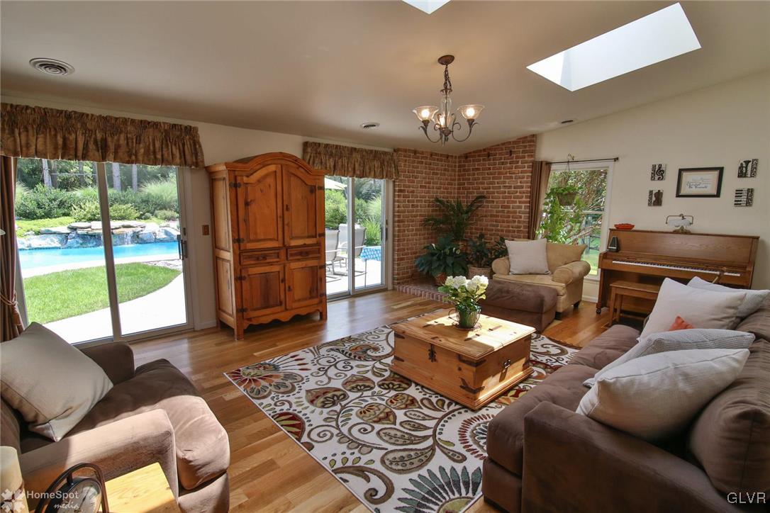 2901 Strohl Road Allentown, PA 18104 - Photo 15 of 39 Great Room with Sliding Doors to Pool, Skylights a