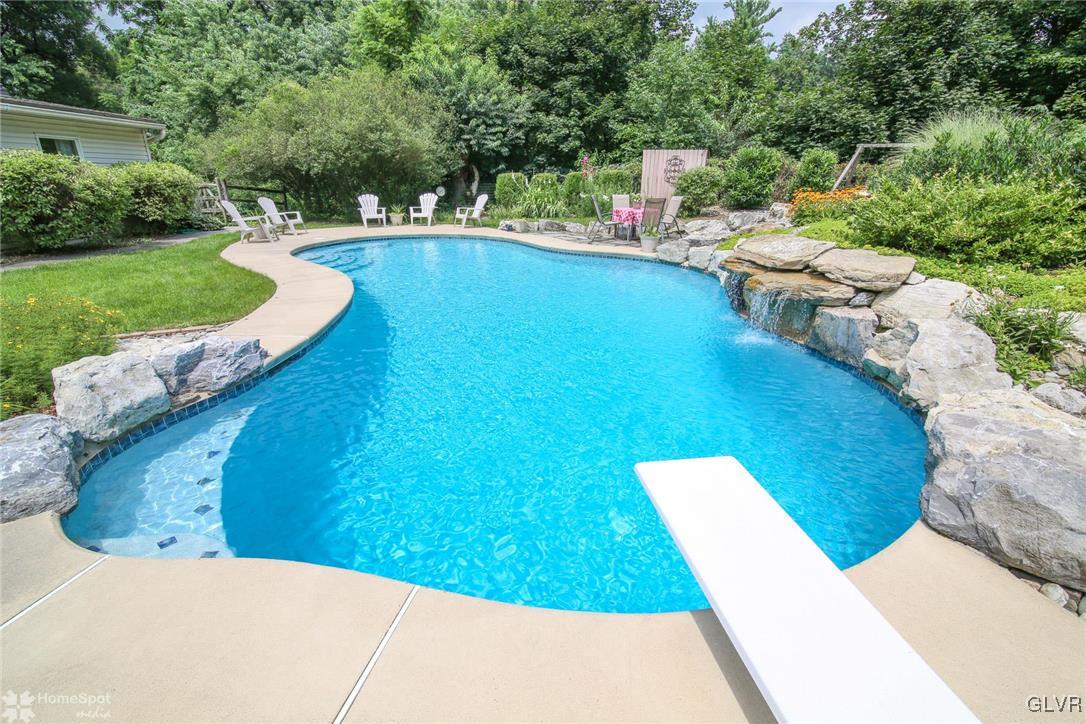 2901 Strohl Road Allentown, PA 18104 - Photo 34 of 39 B&B Pool with Stone Waterfall and Diving Board