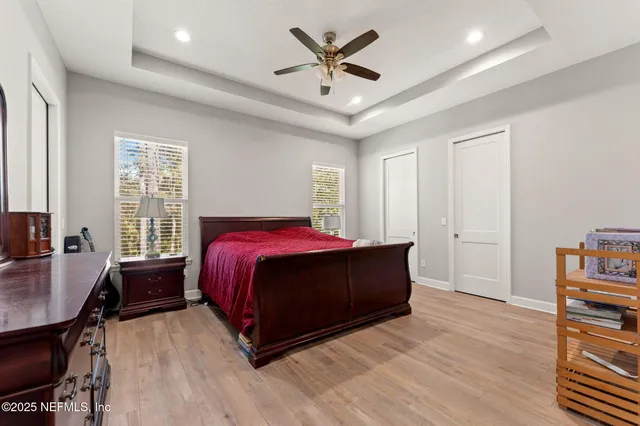 a bed room with a bed and a window