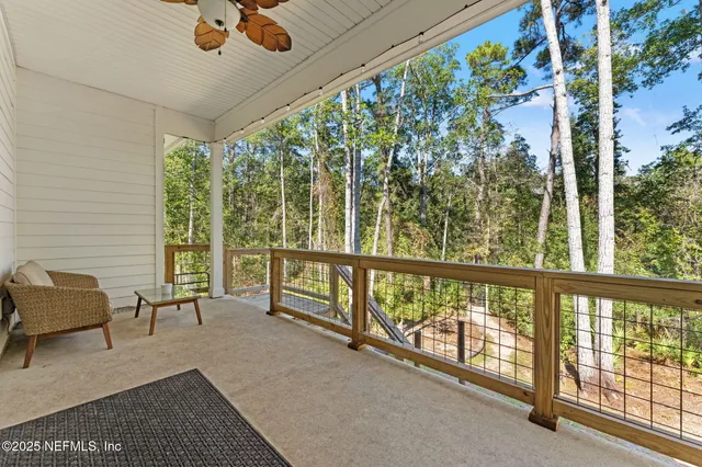 a view of a chairs and table in patio