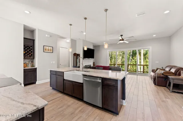 a kitchen with stainless steel appliances granite countertop a stove and cabinets