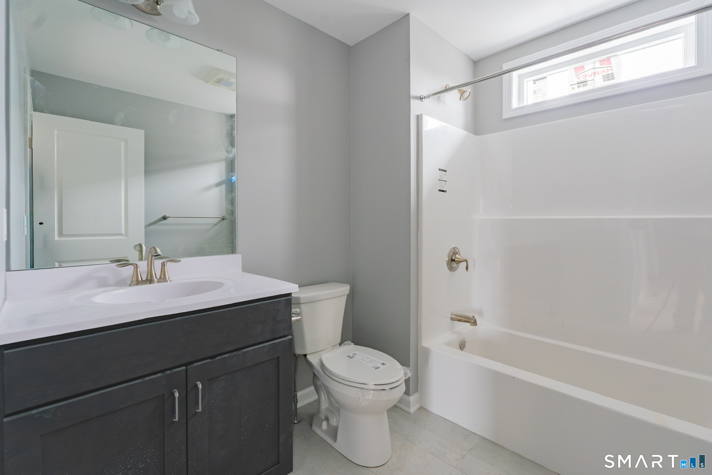 25 Hall Avenue Wallingford, CT 06492 - Photo 13 of 16 a bathroom with a sink a toilet and shower