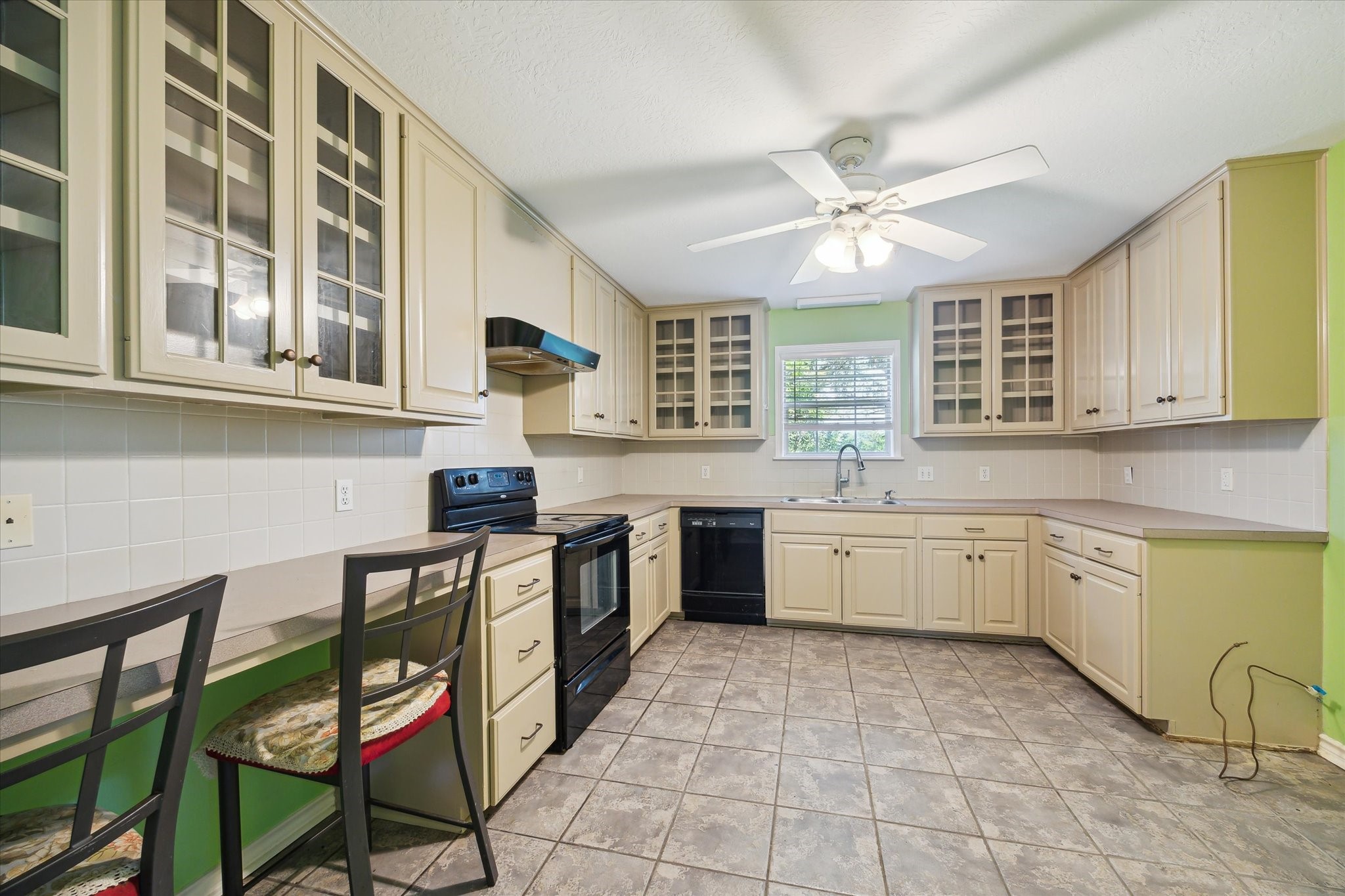 1011 FM 2502 Road Bellville, TX 77418 - Photo 11 of 17 a kitchen with a stove a sink and cabinets