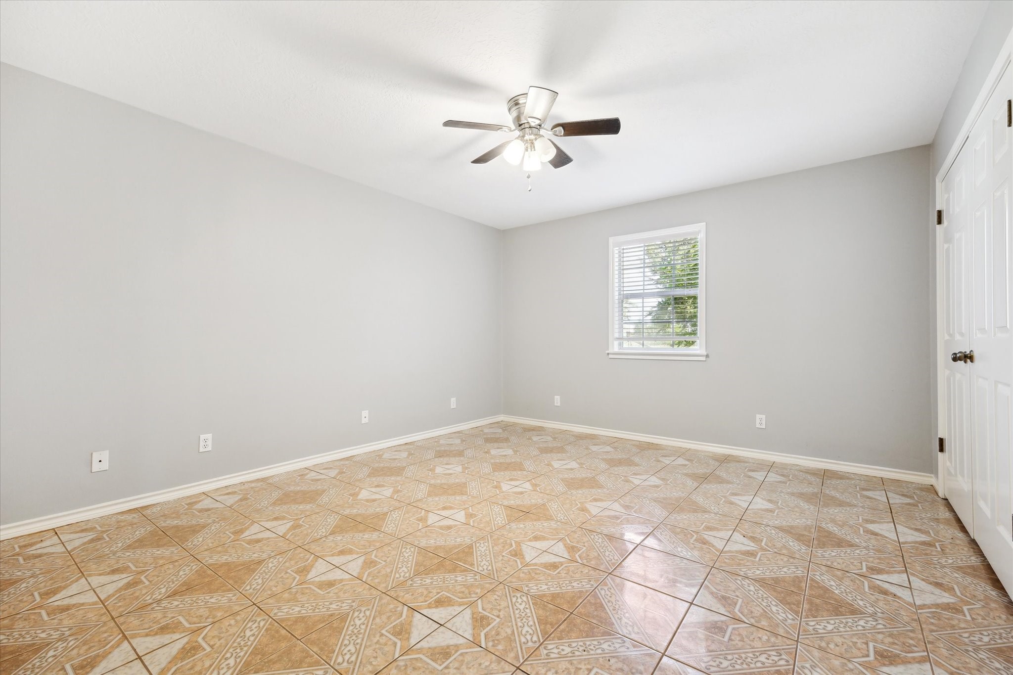 1011 FM 2502 Road Bellville, TX 77418 - Photo 14 of 17 an empty room with a chandelier fan and windows