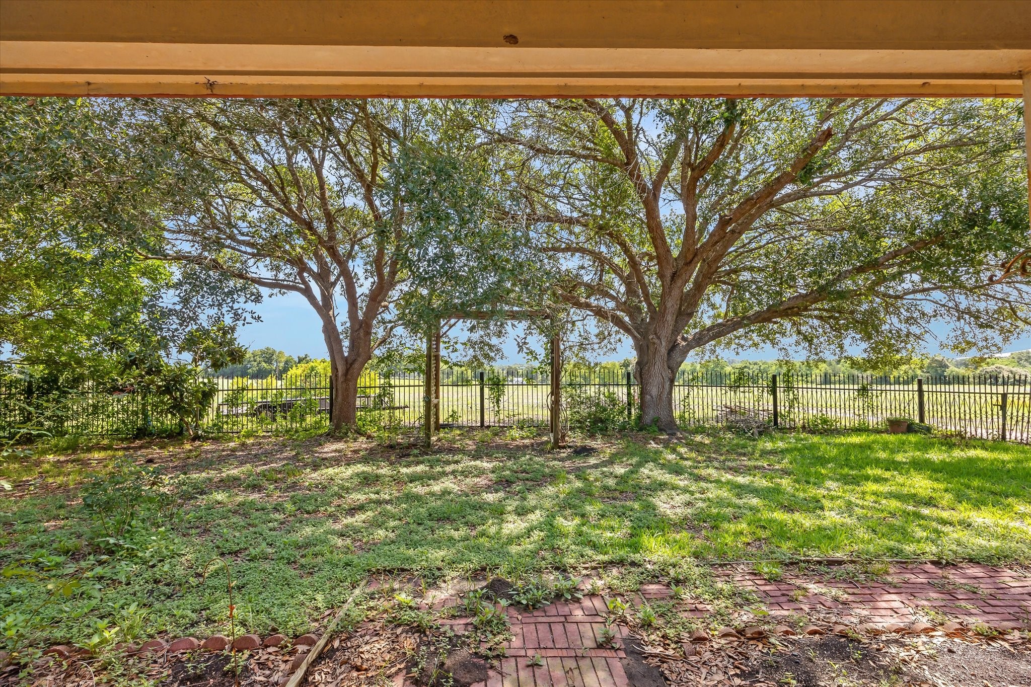 1011 FM 2502 Road Bellville, TX 77418 - Photo 5 of 17 a view of a backyard of the house