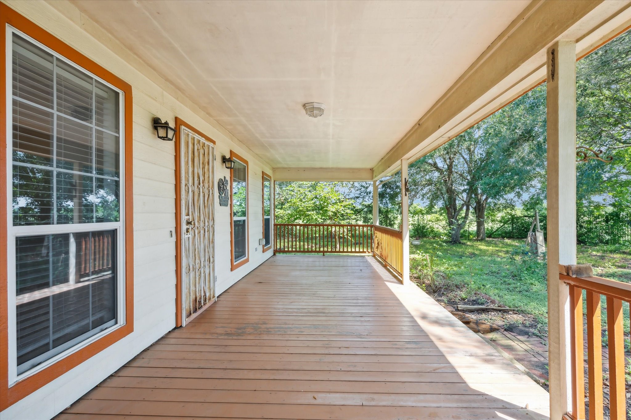 1011 FM 2502 Road Bellville, TX 77418 - Photo 6 of 17 a view of a porch with wooden floor and outdoor space