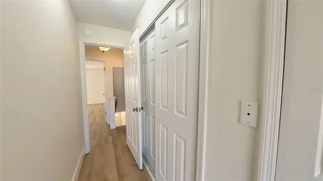 a view of a bathroom from a hallway