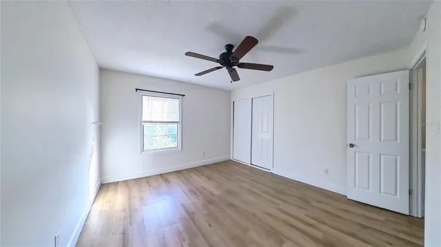 a view of room window and wooden floor