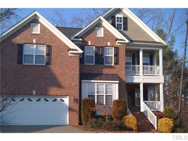 8620 Royton Circle Raleigh, NC 27613 - Photo 1 of 25 Charming double porches are featured on this brick front home. Backs to wooded natural open space!!! Exterior Front