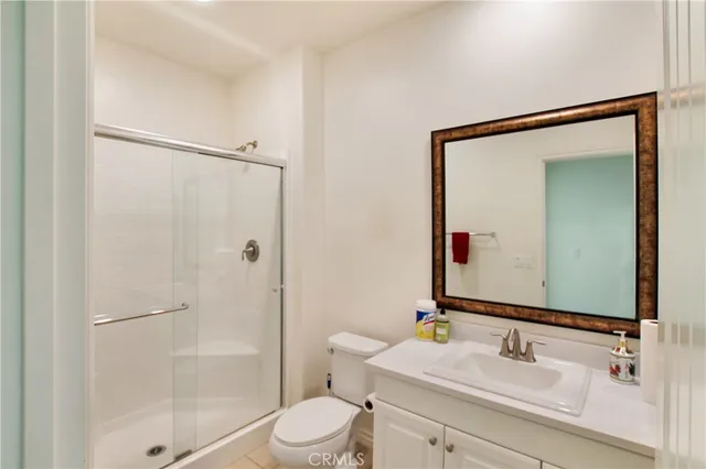 a view of a livingroom with a ceiling fan and a window