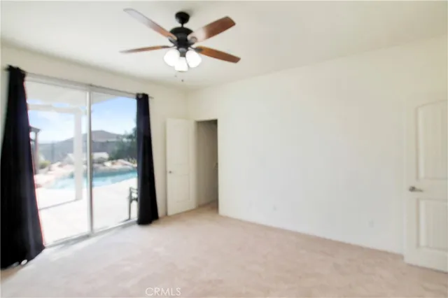 a kitchen with stainless steel appliances granite countertop a refrigerator sink and white cabinets