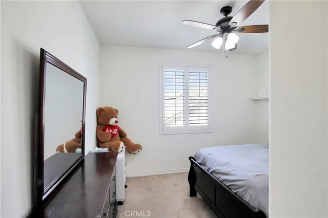 a bedroom with furniture and a window