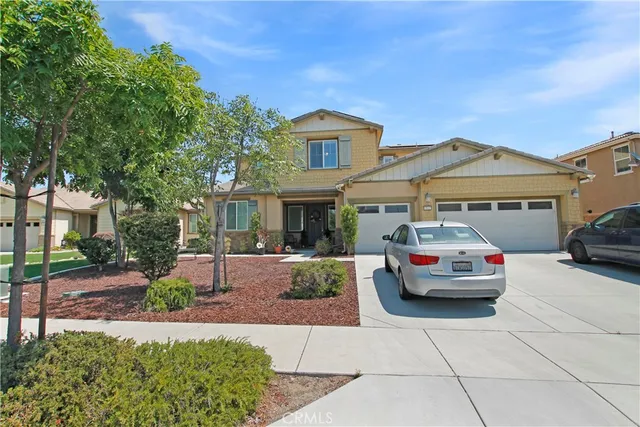 a front view of a house with garden