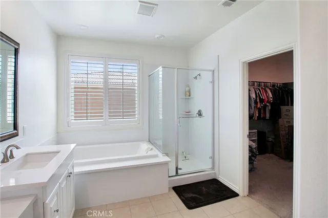 a view of a house with swimming pool and sitting area