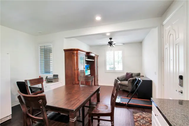 a view of a dining room with furniture and window