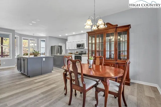 a dining room with furniture window wooden floor