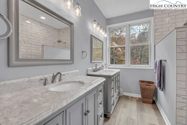 a white toilet sitting next to a bathroom sink