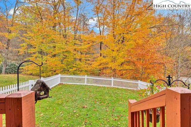 a view of a chairs and table in the balcony