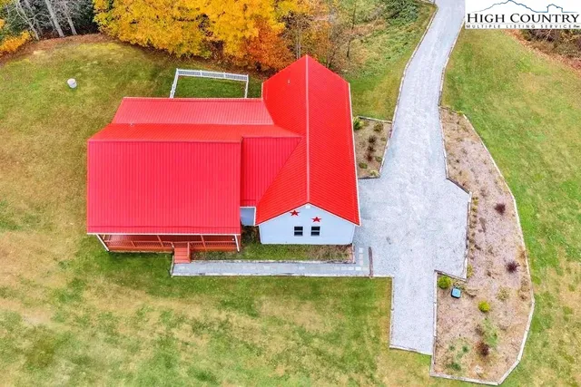 a view of a wooden deck with a yard