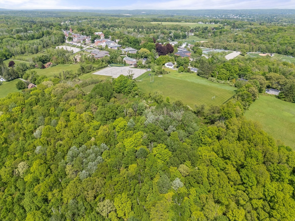 0 Center Road Dudley, MA 01571 - Photo 6 of 12 a view of a city with lush green forest