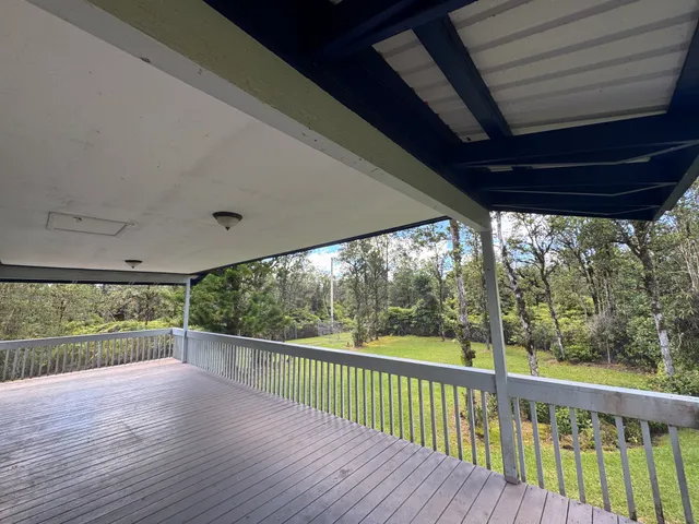 a view of a deck with wooden floor and outdoor space