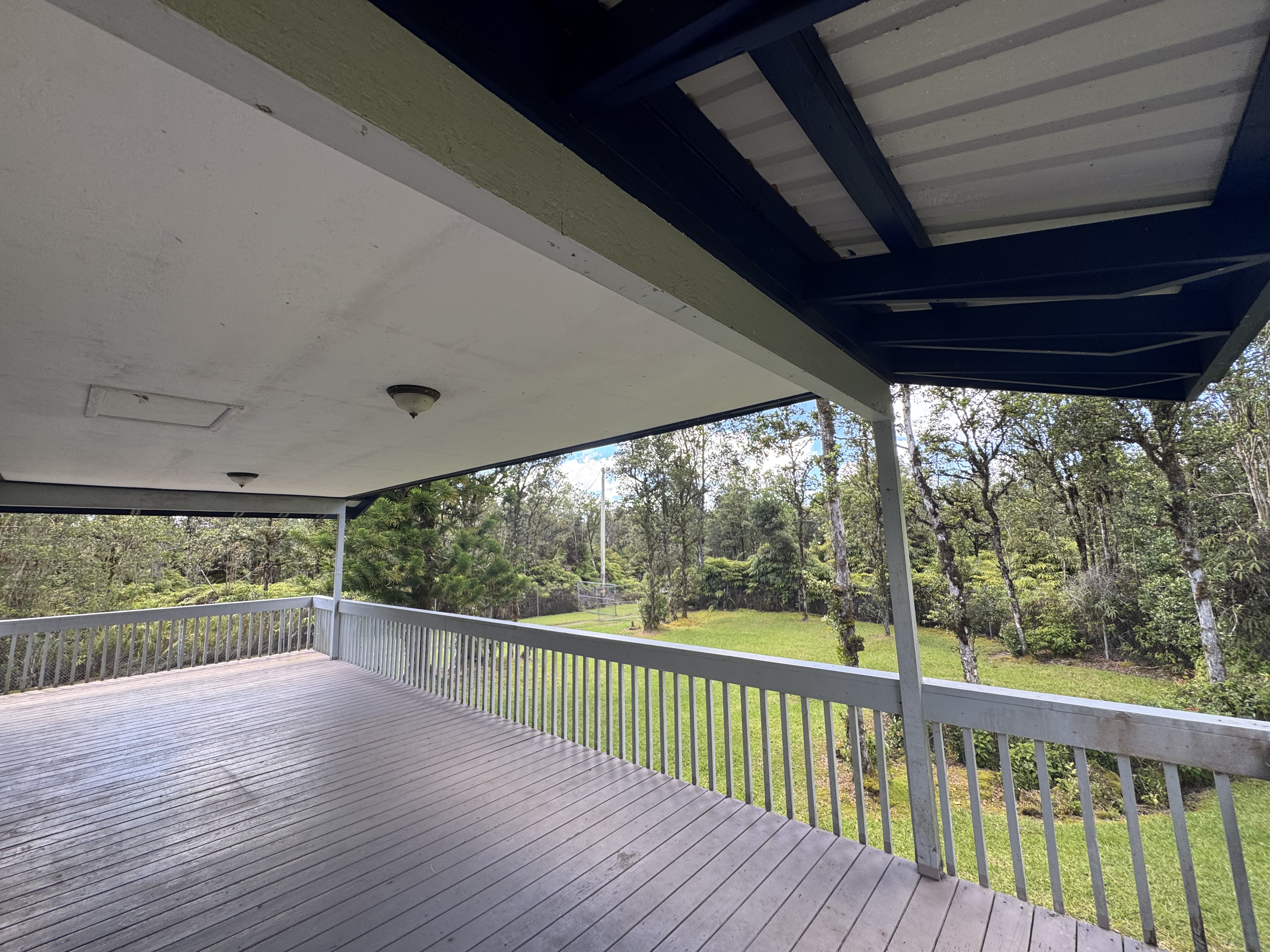 11-3132 Hibiscus Street Mountain View, HI 96771 - Photo 15 of 27 a view of a deck with wooden floor and outdoor space