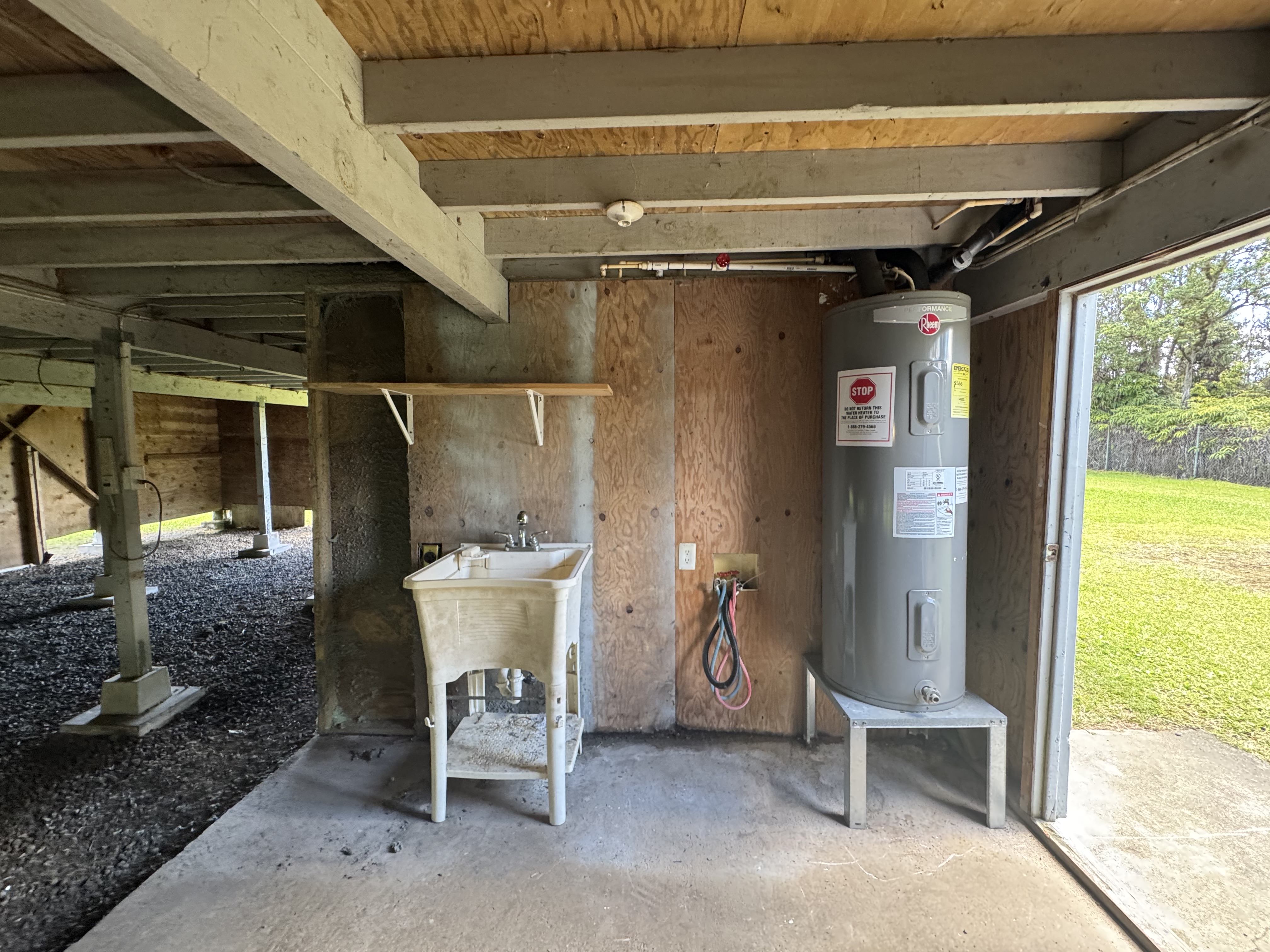 11-3132 Hibiscus Street Mountain View, HI 96771 - Photo 16 of 27 a view of a patio with table and chairs and potted plants