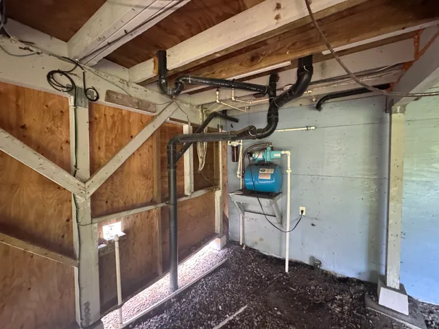 a view of a room with wooden walls