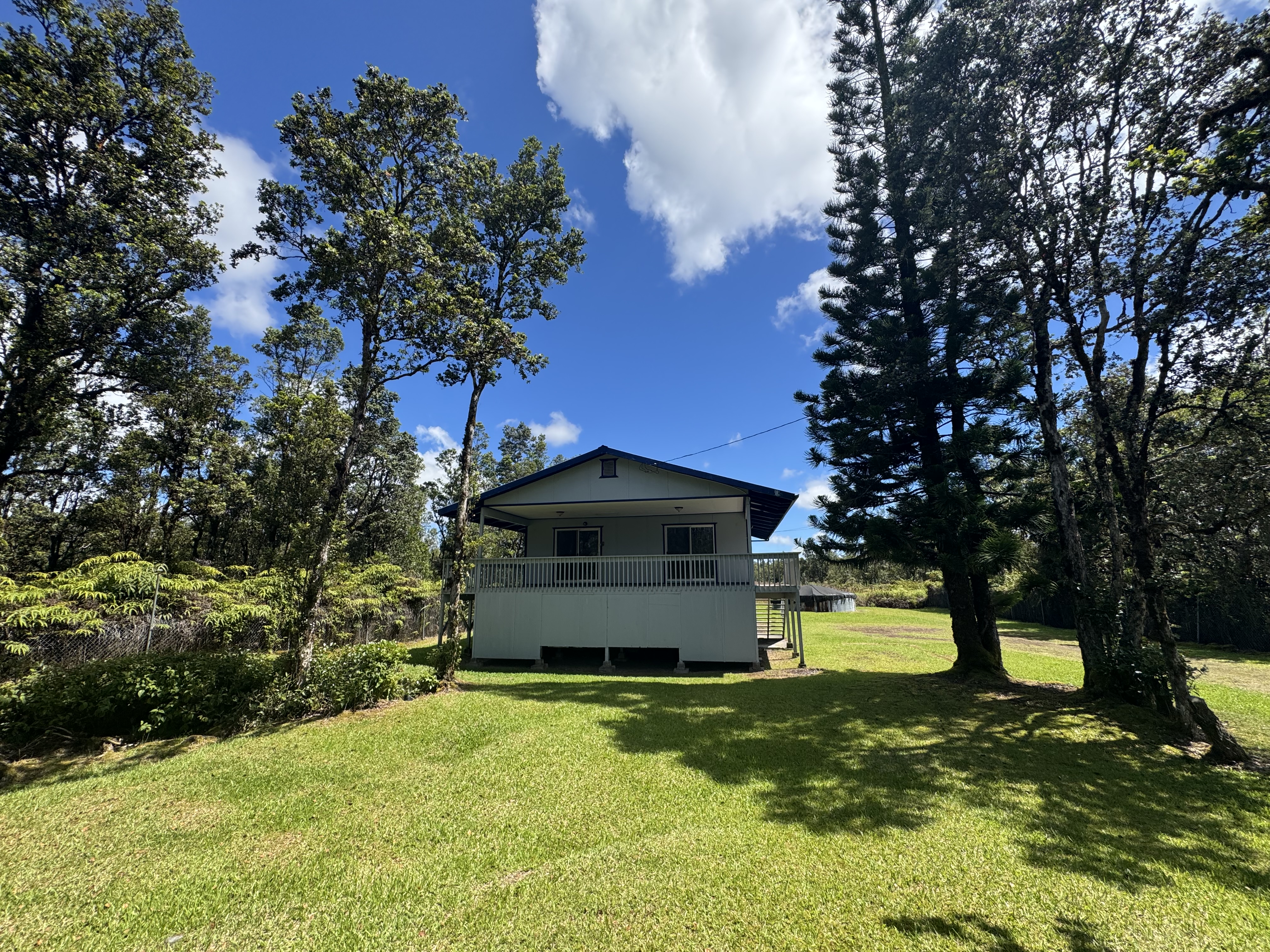 11-3132 Hibiscus Street Mountain View, HI 96771 - Photo 19 of 27 a view of a garden with large trees