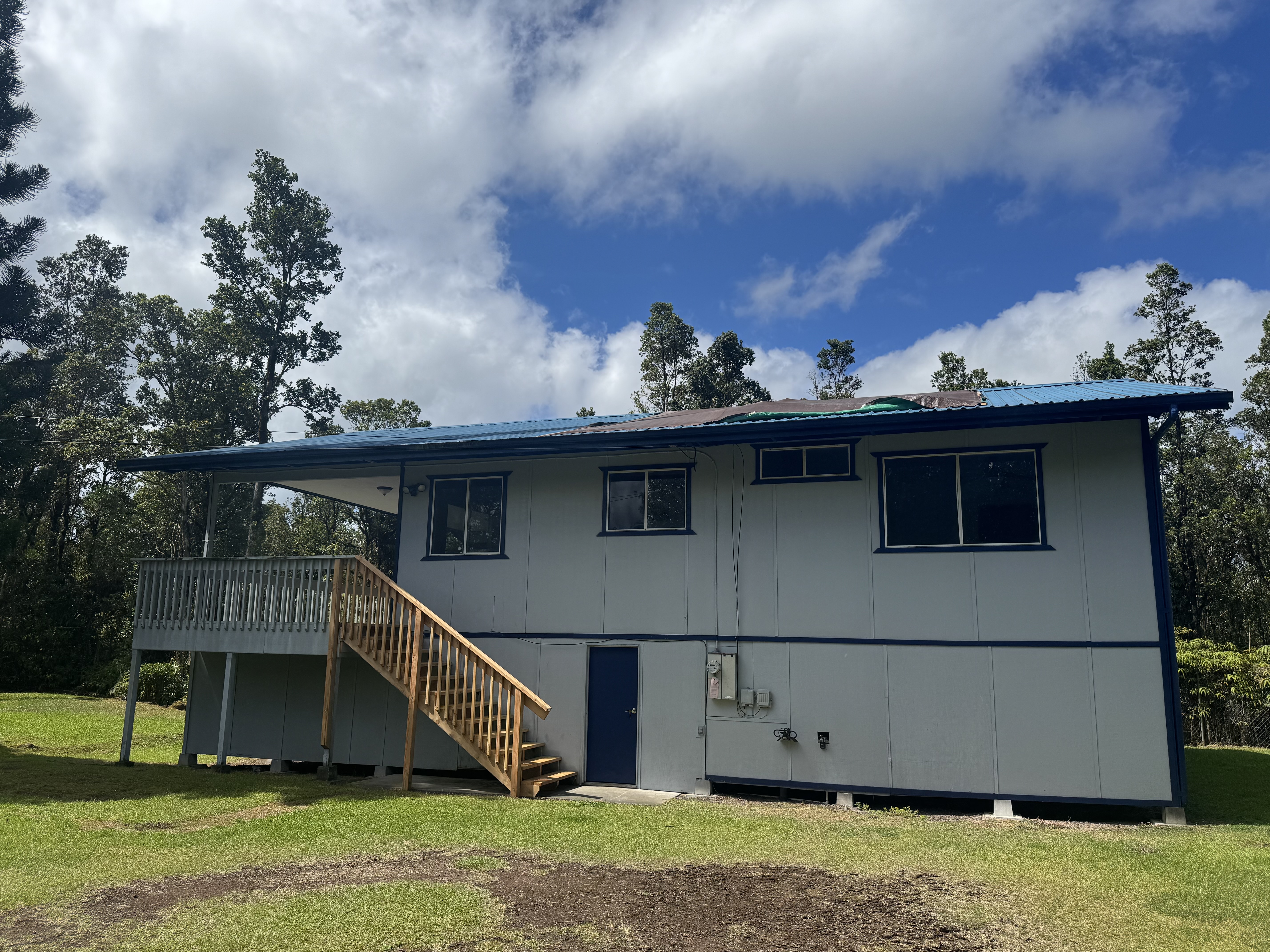 11-3132 Hibiscus Street Mountain View, HI 96771 - Photo 26 of 27 a view of a house with a yard