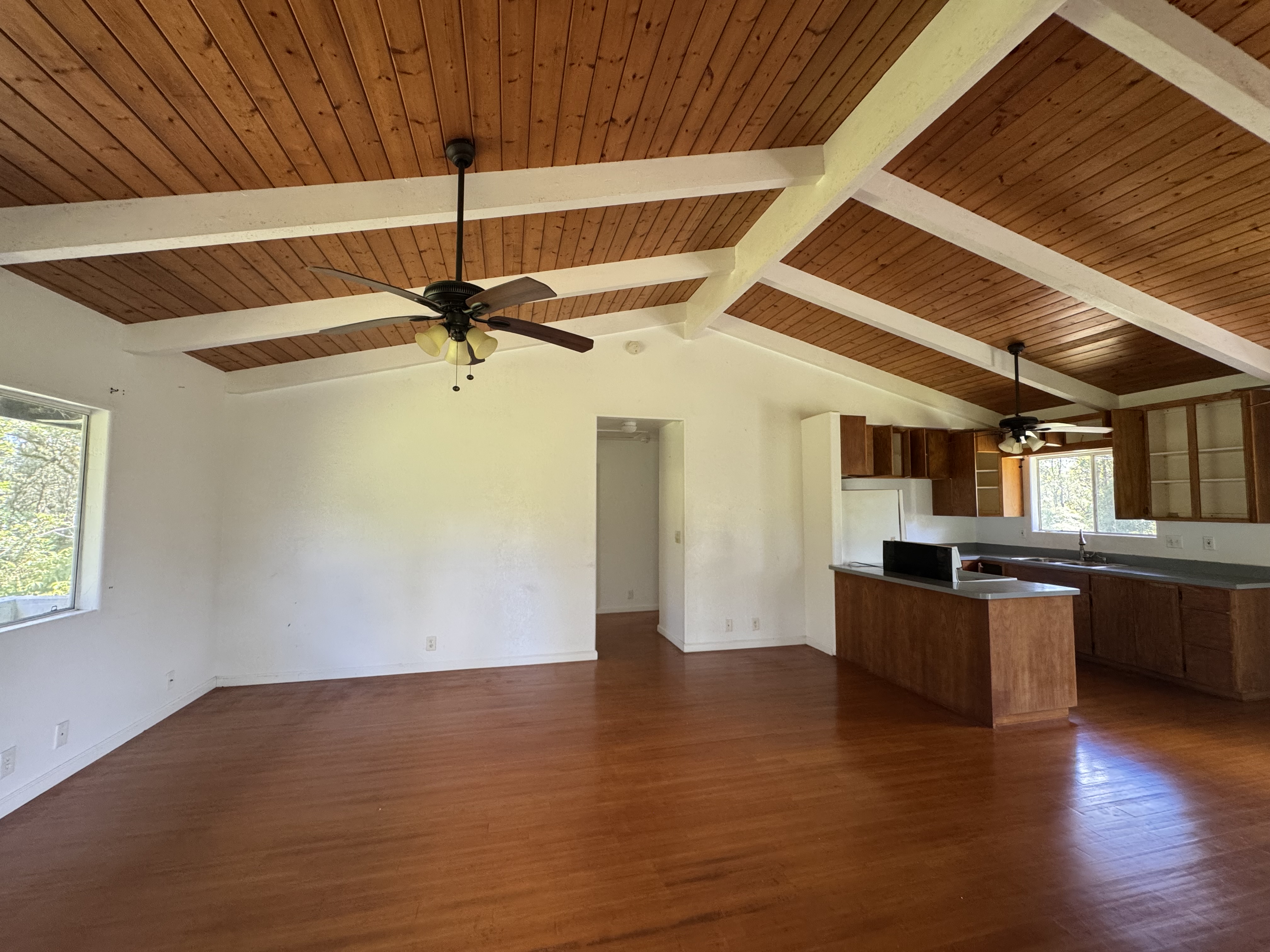11-3132 Hibiscus Street Mountain View, HI 96771 - Photo 3 of 27 a kitchen with stainless steel appliances granite countertop a sink and cabinets