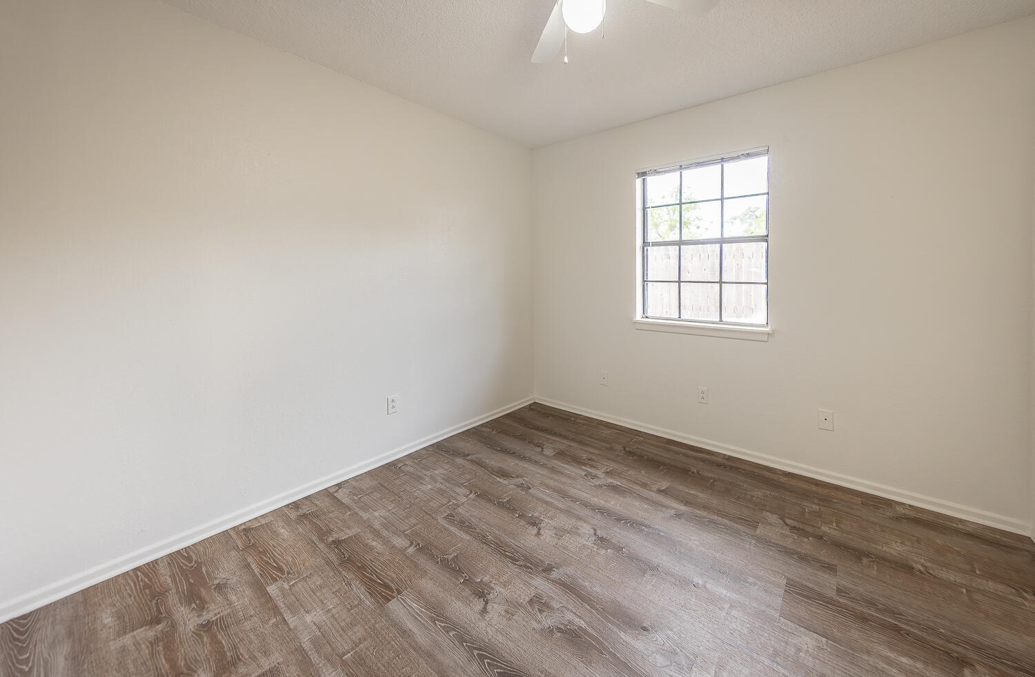 6305 35th Street Lubbock, TX 79407 - Photo 11 of 20 an empty room with a window