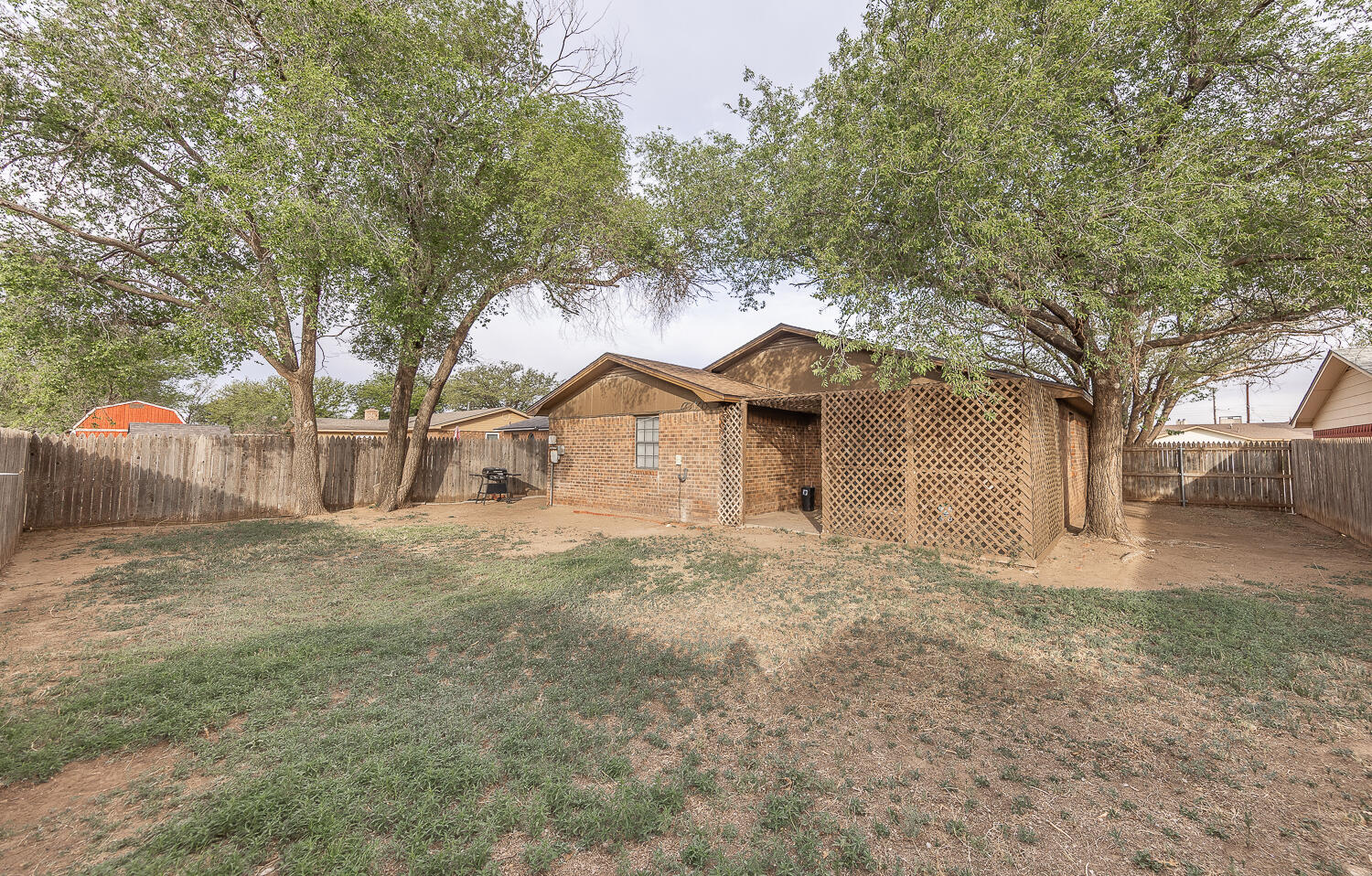 6305 35th Street Lubbock, TX 79407 - Photo 19 of 20 a front view of a house with a yard and garage