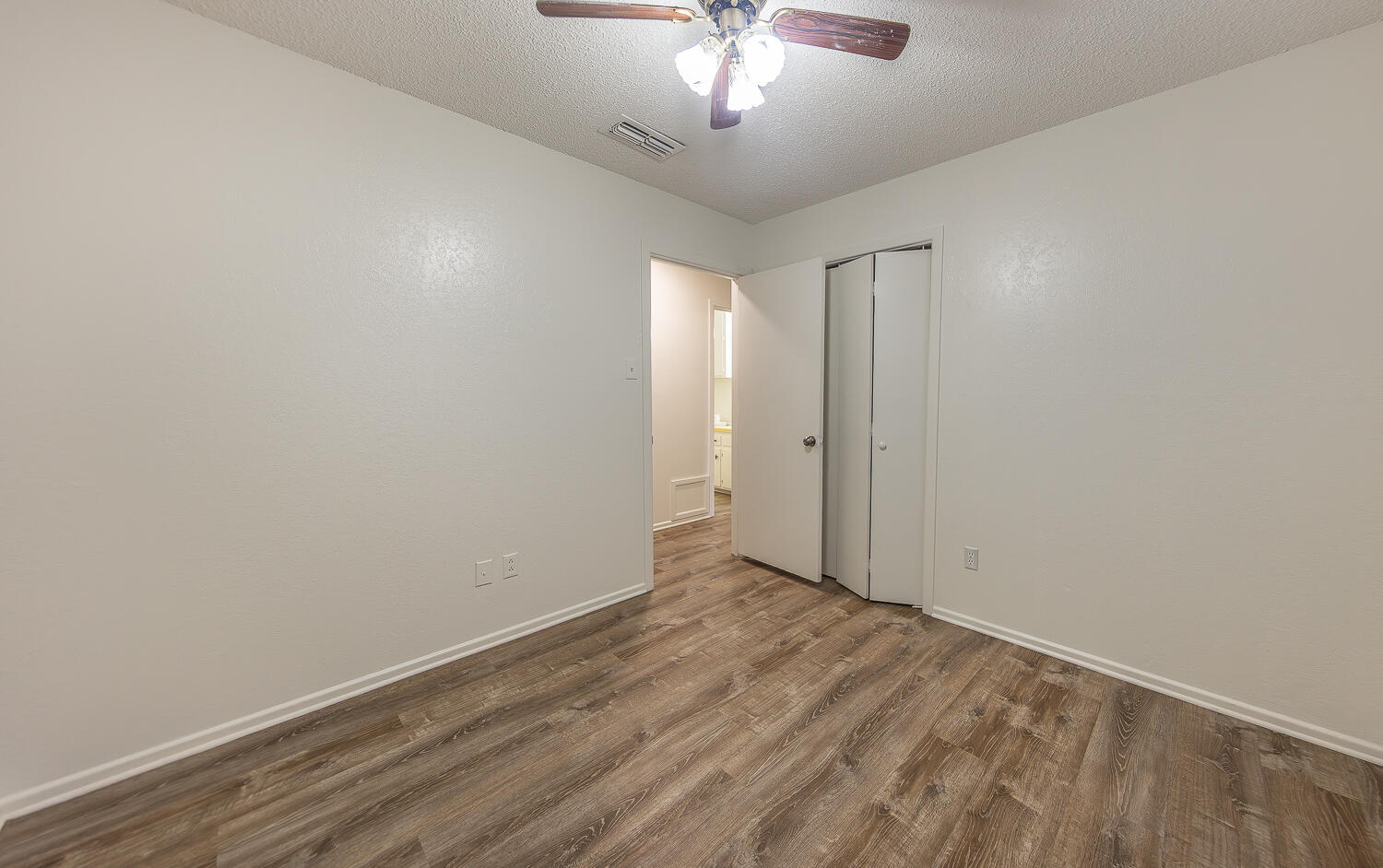 6305 35th Street Lubbock, TX 79407 - Photo 10 of 20 wooden floor in an empty room